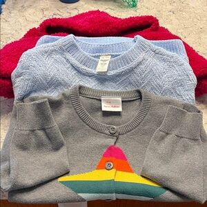 A bundle of 4 sweaters. Size 5. GUC